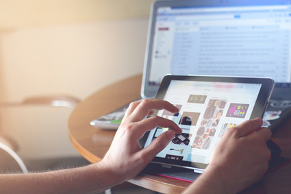 Image of person shopping on mobile tablet. Image of person shopping on mobile tablet.