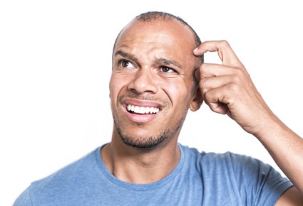 Image of man scratching his head in confusion over poor content marketing strategies