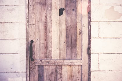 Image of wooden door. A good web design strategy will help visitors better acces your site.