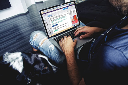 Image of man using laptop. Effective web design takes the end user's needs into account.