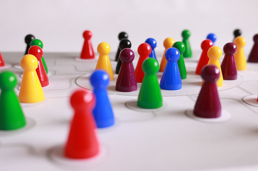 Image of multi-color game pieces. Blogging is a great way to connect and network via social media marketing.