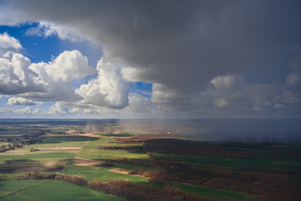 rain-sun-weather-over-farmland.png