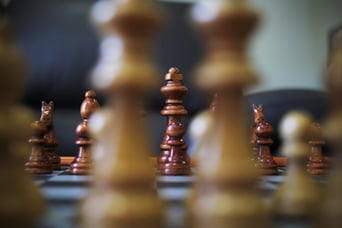 Image of a king piece on a chess board. Content marketing is said to be king, but inbound marketing strategies help grow revenue and engagement.