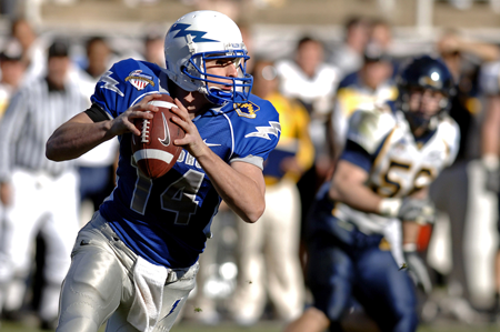 Image of quarterback securing football. Hire an inbound marketing company to leverage lead generation techniques.